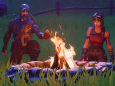 Fortnite Campfire With Multiple People Near It In A Field
